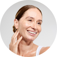 Woman with a happy expression with glowing, sculpted skin