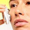 Woman using ZIIP HALO on her face