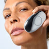 Woman using ZIIP HALO to contour her cheeks