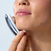 Woman using ZIIP HALO to sculpt her jaw