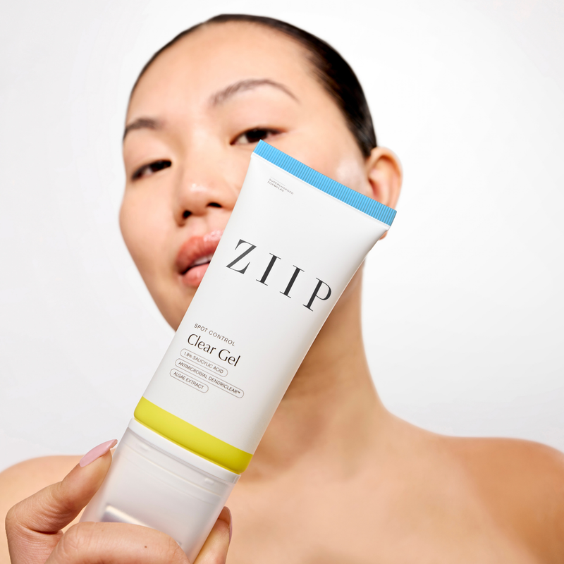 Woman holding the ZIIP Clear Gel